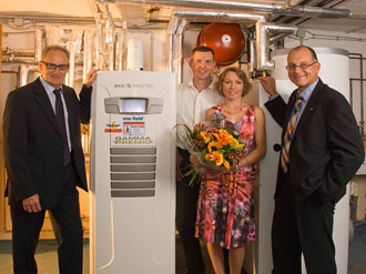 Installation of the Elcore 2400 system at family Aberl: JörgSchröter, Schröter  Haustechnik (left) , Martin Eichelbrönner, Elcore GmbH (right) and family Aberl  represented by their last born son.